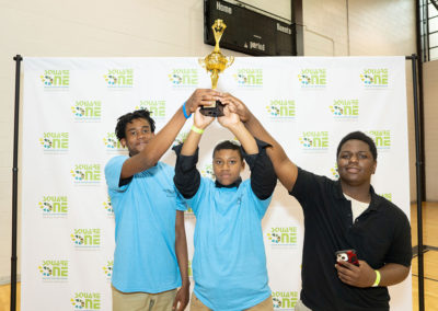 Students posing with a trophy from this years competition